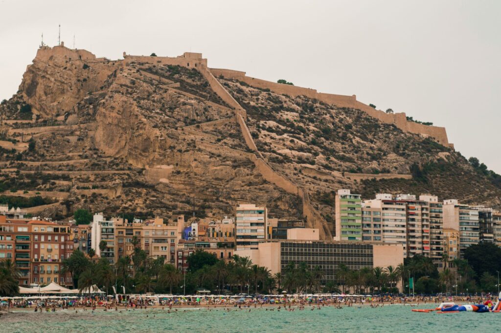 Alicante castle (Castillo de Santa Barbara) sitting on top of a mountain 